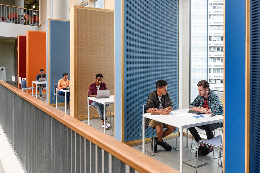 Students working in modern study cubicles at FE college